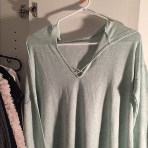 Long sleeve light blue/green shirt with hood